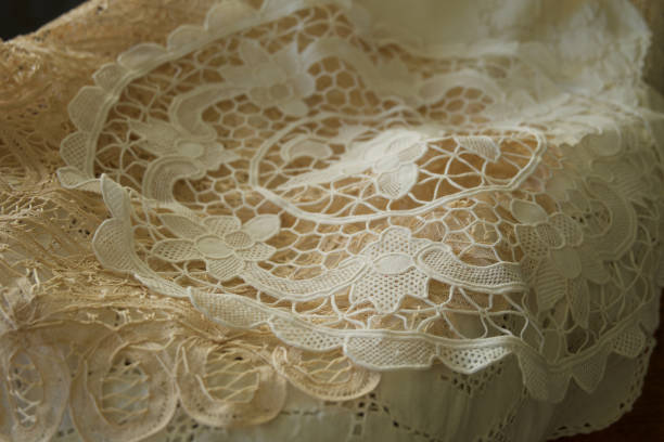 close up image of lace fabric with soft natural light has a romantic mood.